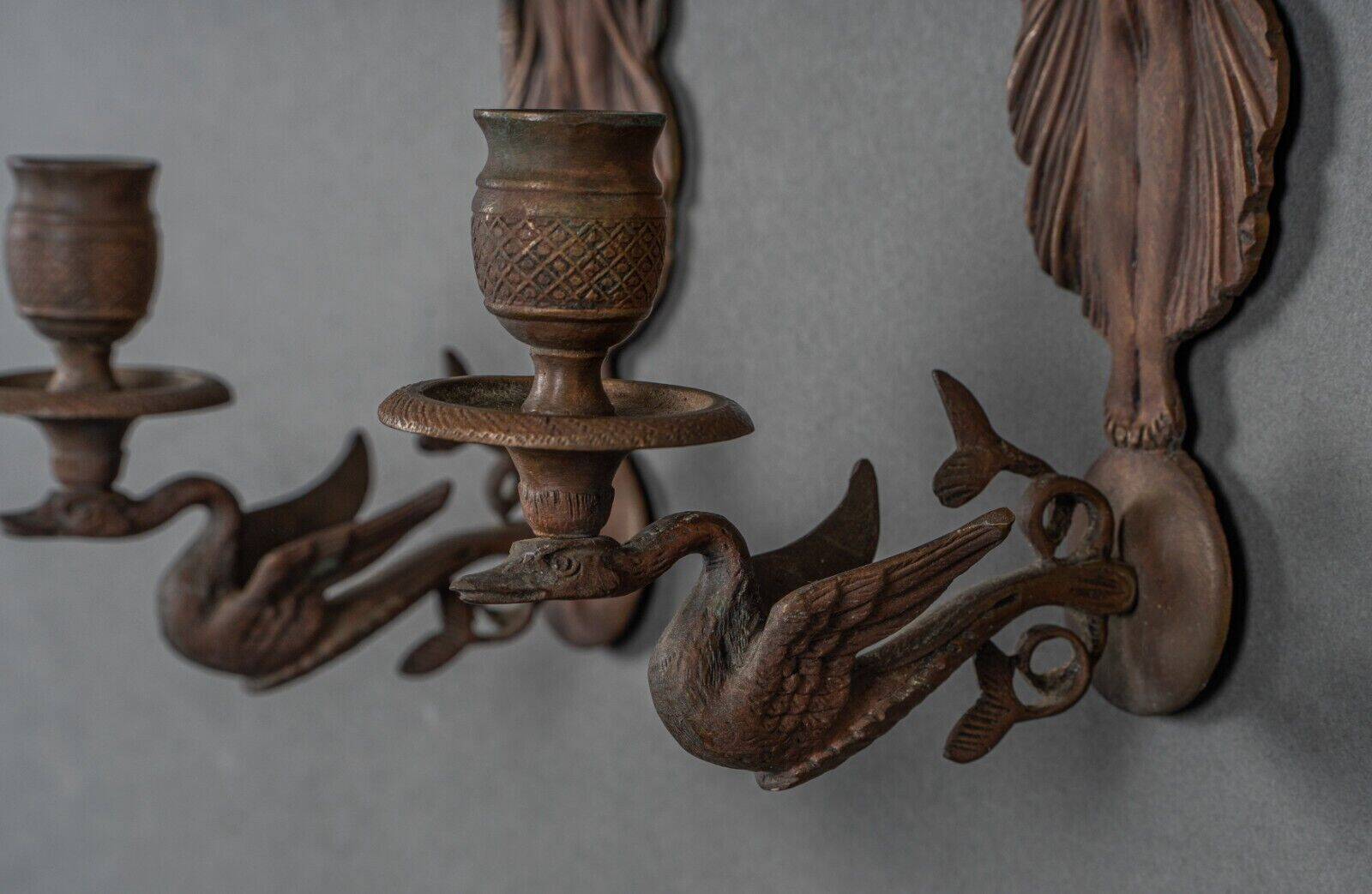 Pair of Empire period bronze sconces decorated with a winged woman
