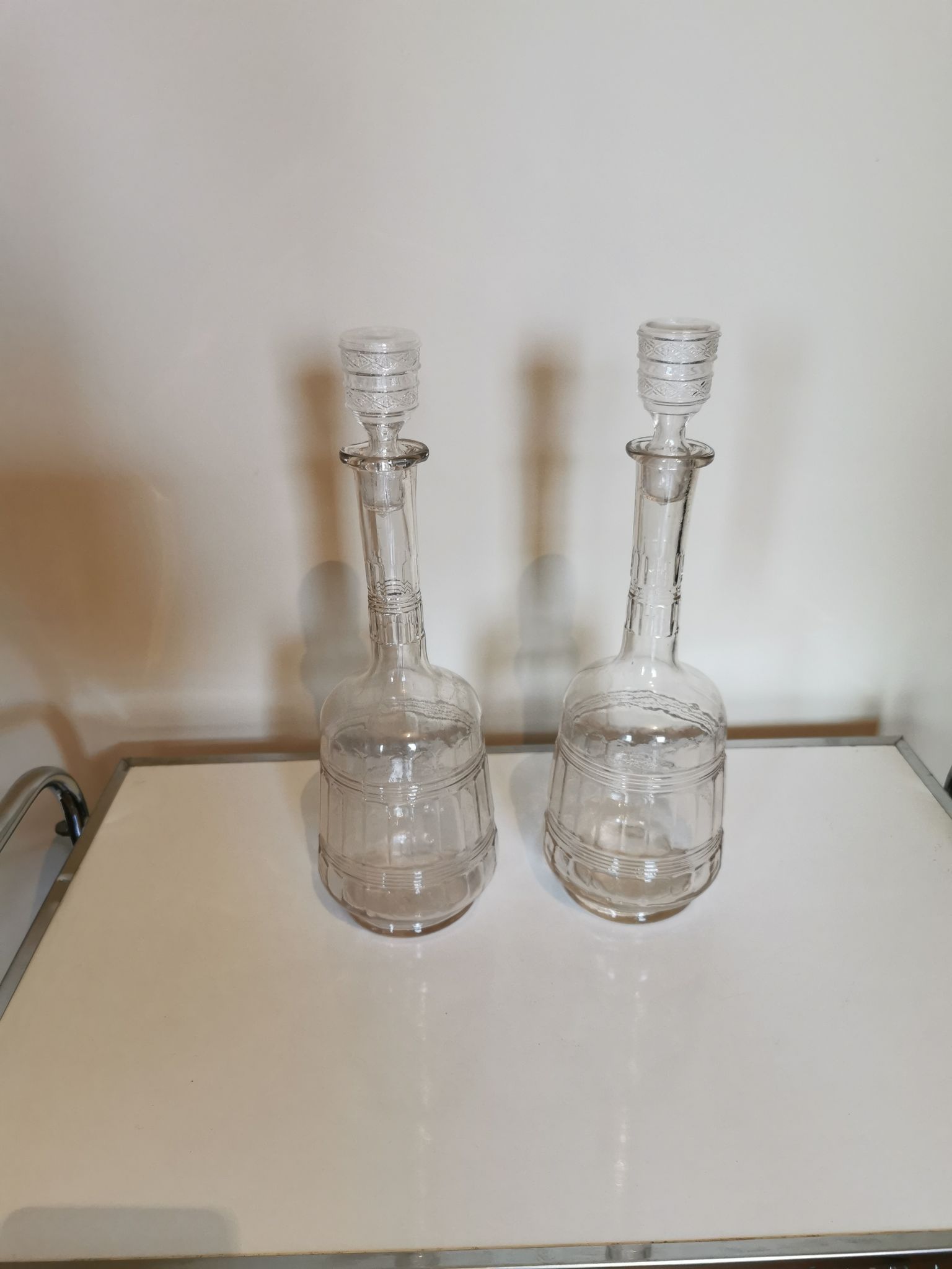 Pair of antique moulded glass carafes