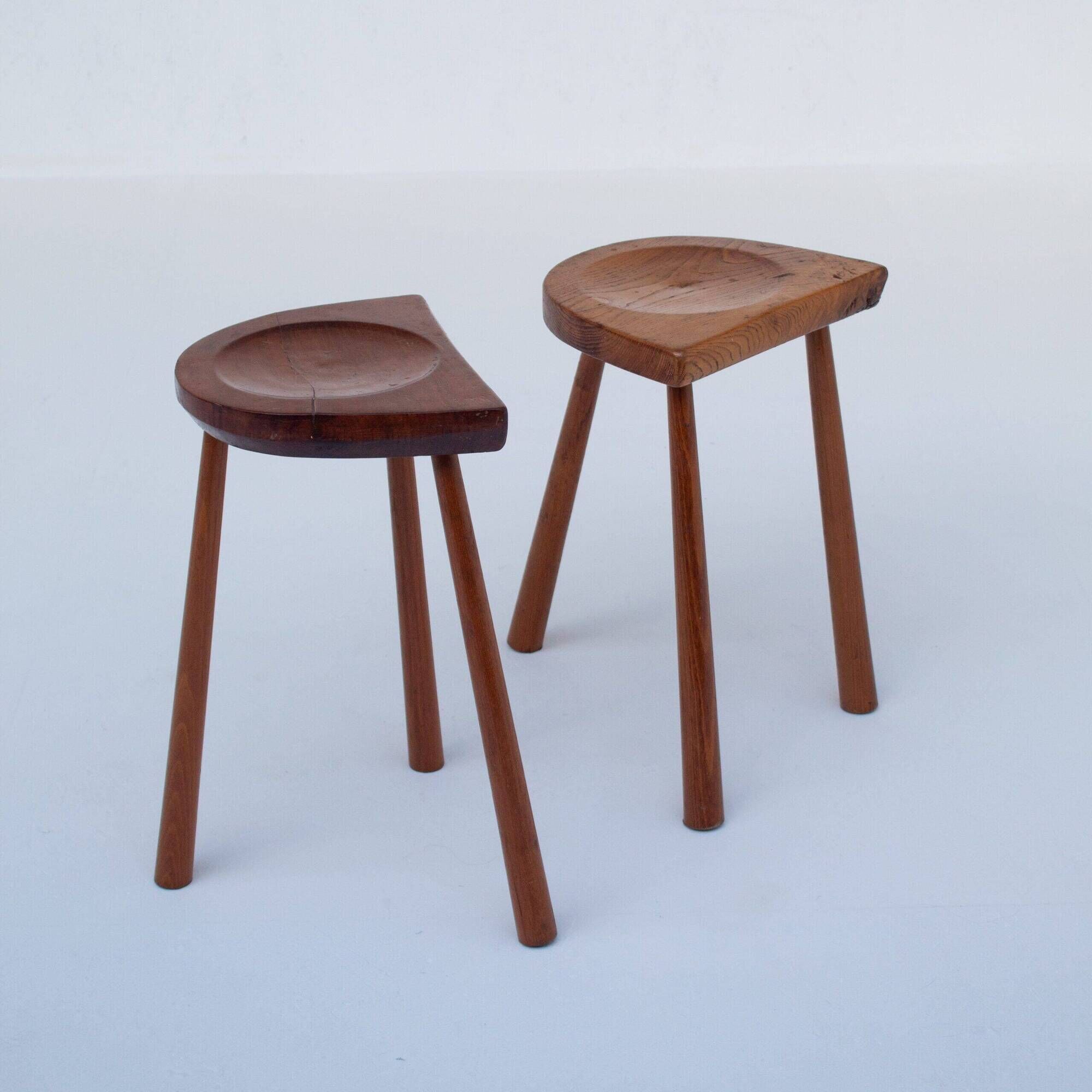 Set of two hand-carved wooden stools with sculpted seats