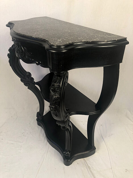 Pair of blackened wooden consoles, marble top