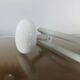 White lacquered metal wall coat rack with 3 hooks, 1970.