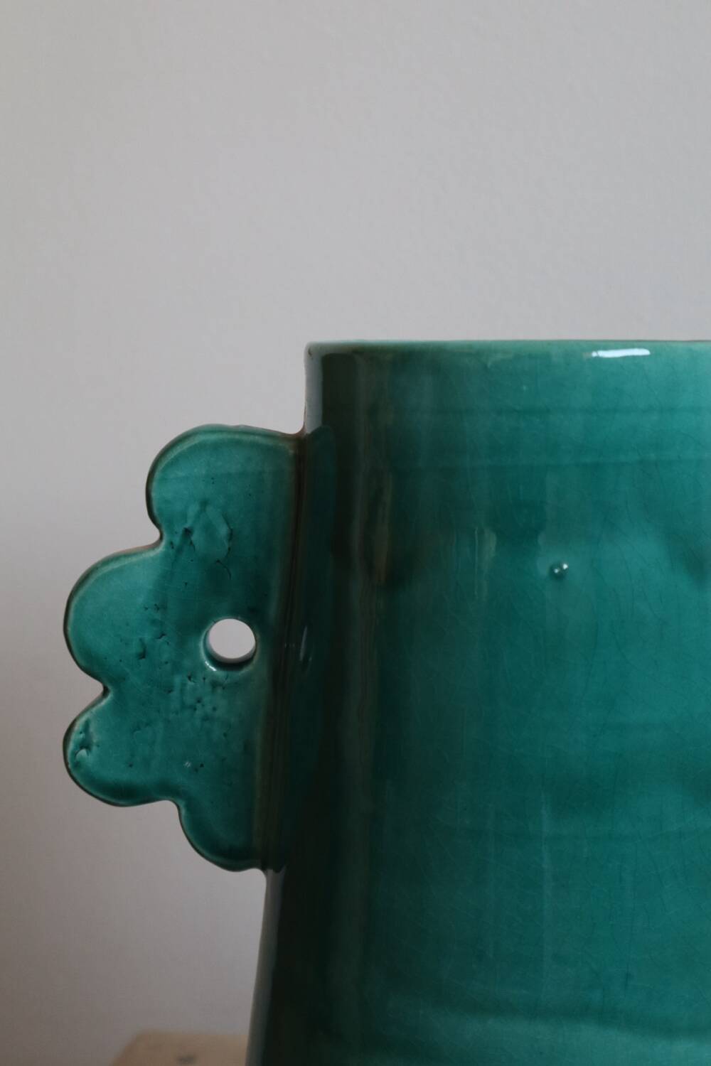 Handmade ceramic abstract vase with large handles and turquoise blue flowers