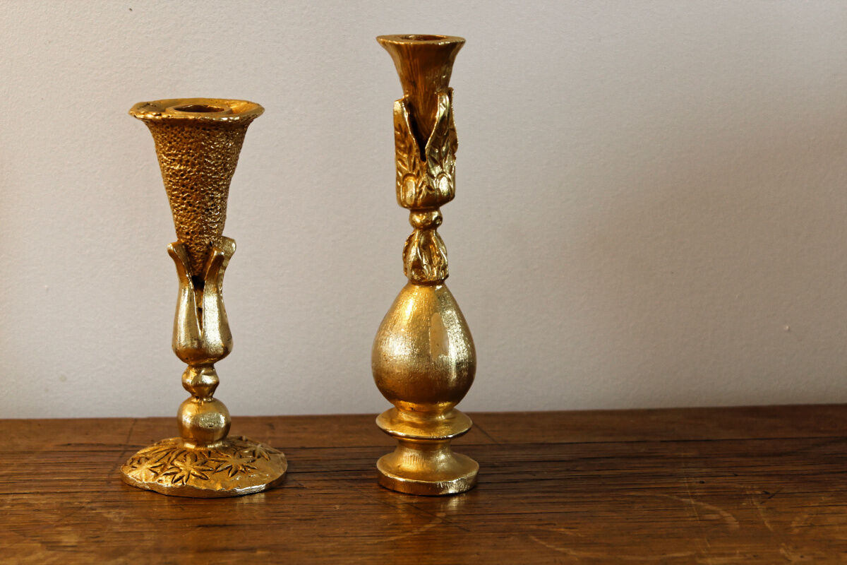 Pair of handmade candle holders, cast iron