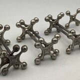 Set of 7 vintage knife rests in the shape of crosses in silver-plated metal.