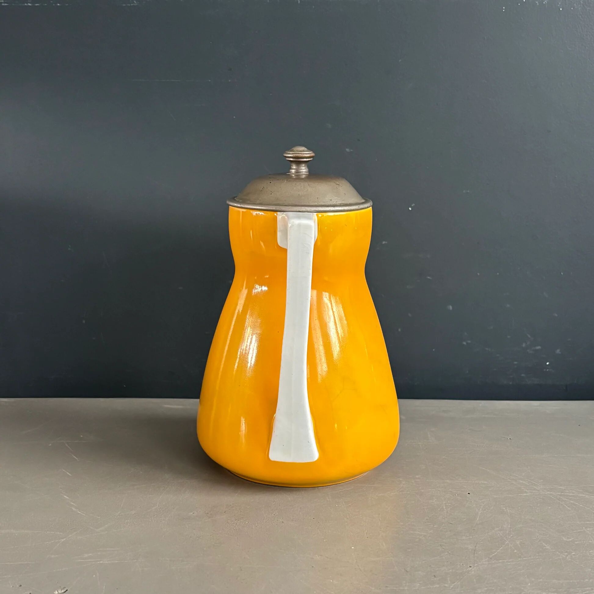 Antique teapot in earthenware with a tin filter lid.