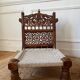 Pair of traditional Indian chairs made of carved wood and rope