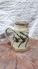 Hand-decorated and signed berry earthen pitcher
