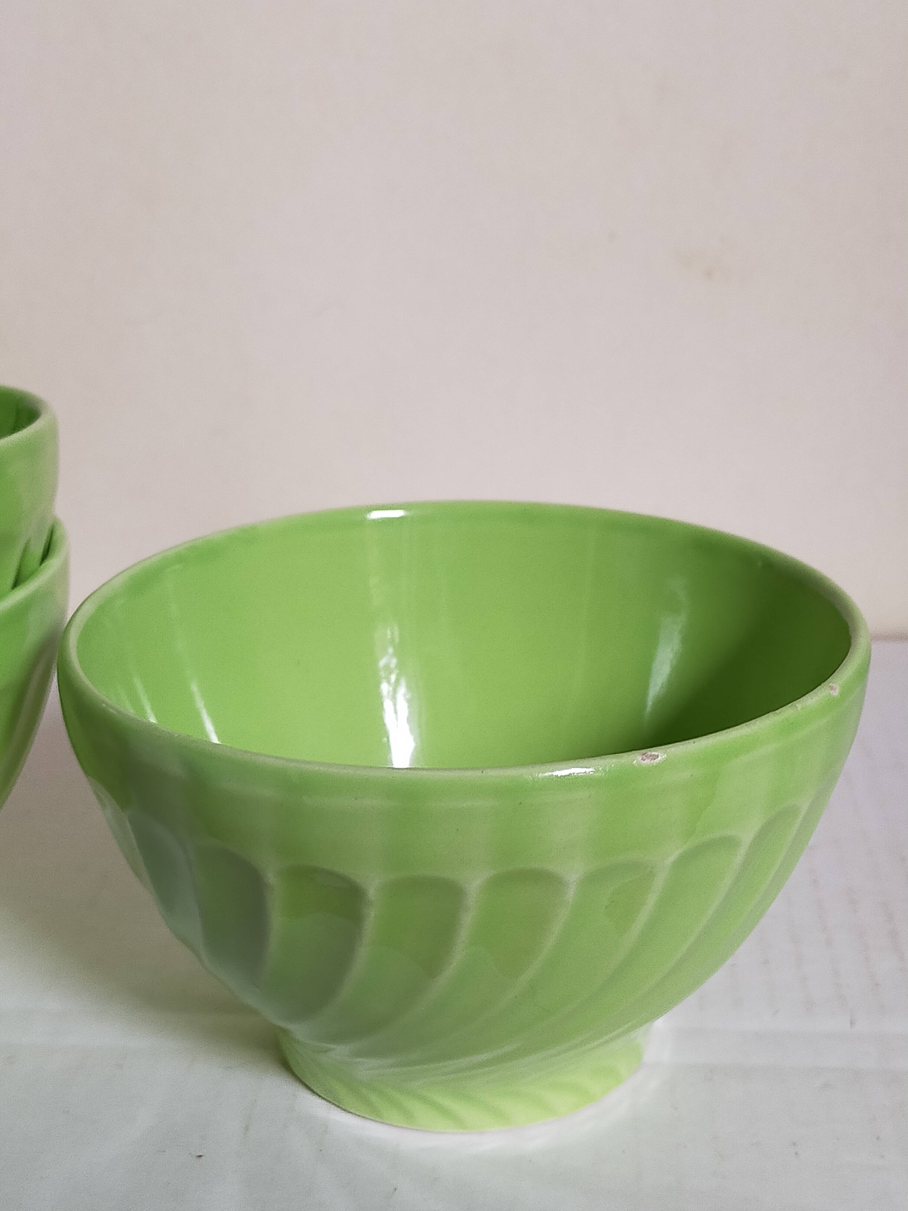 Four vintage spring green earthenware bowls