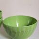 Four vintage spring green earthenware bowls