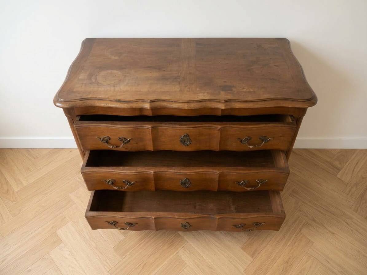 Antique curved wooden commode in classic style