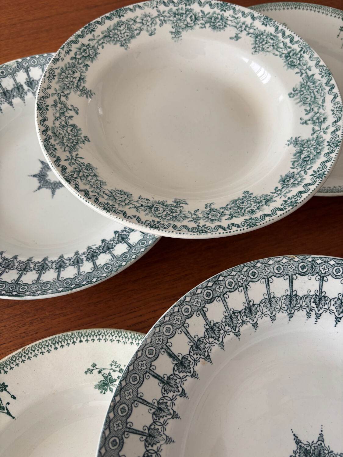 A deep plate in blue and green ironstone, antique French earthenware.