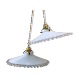 Pair of pendants in white opaline and transparent serrated edges