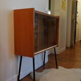 Small window on high metal feet