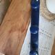 Coat rack with 3 blue hooks
