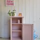 Antique bedside table revamped in pink.