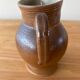 Pitcher in glazed sandstone
