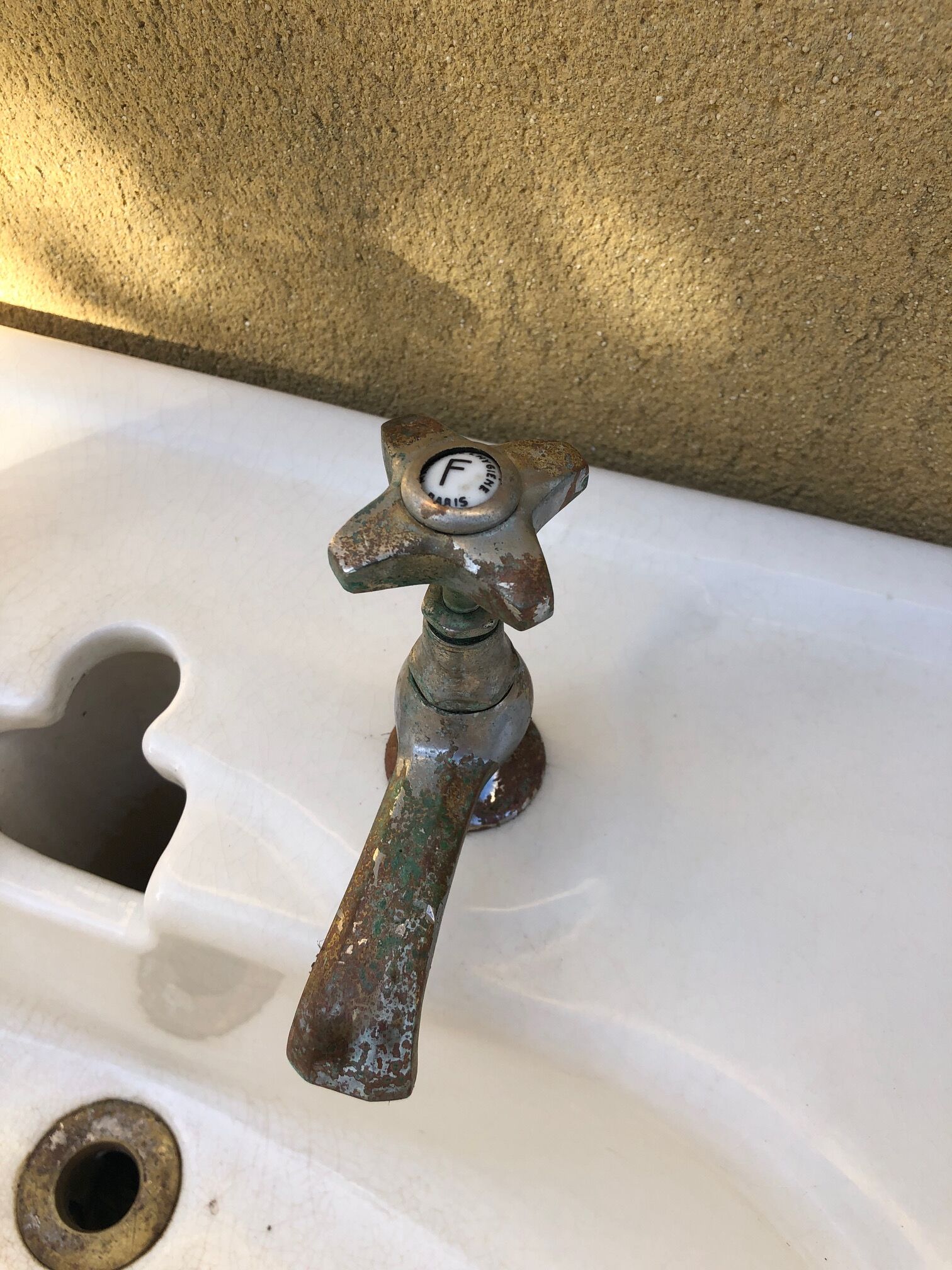 Antique washbasin on ceramic column