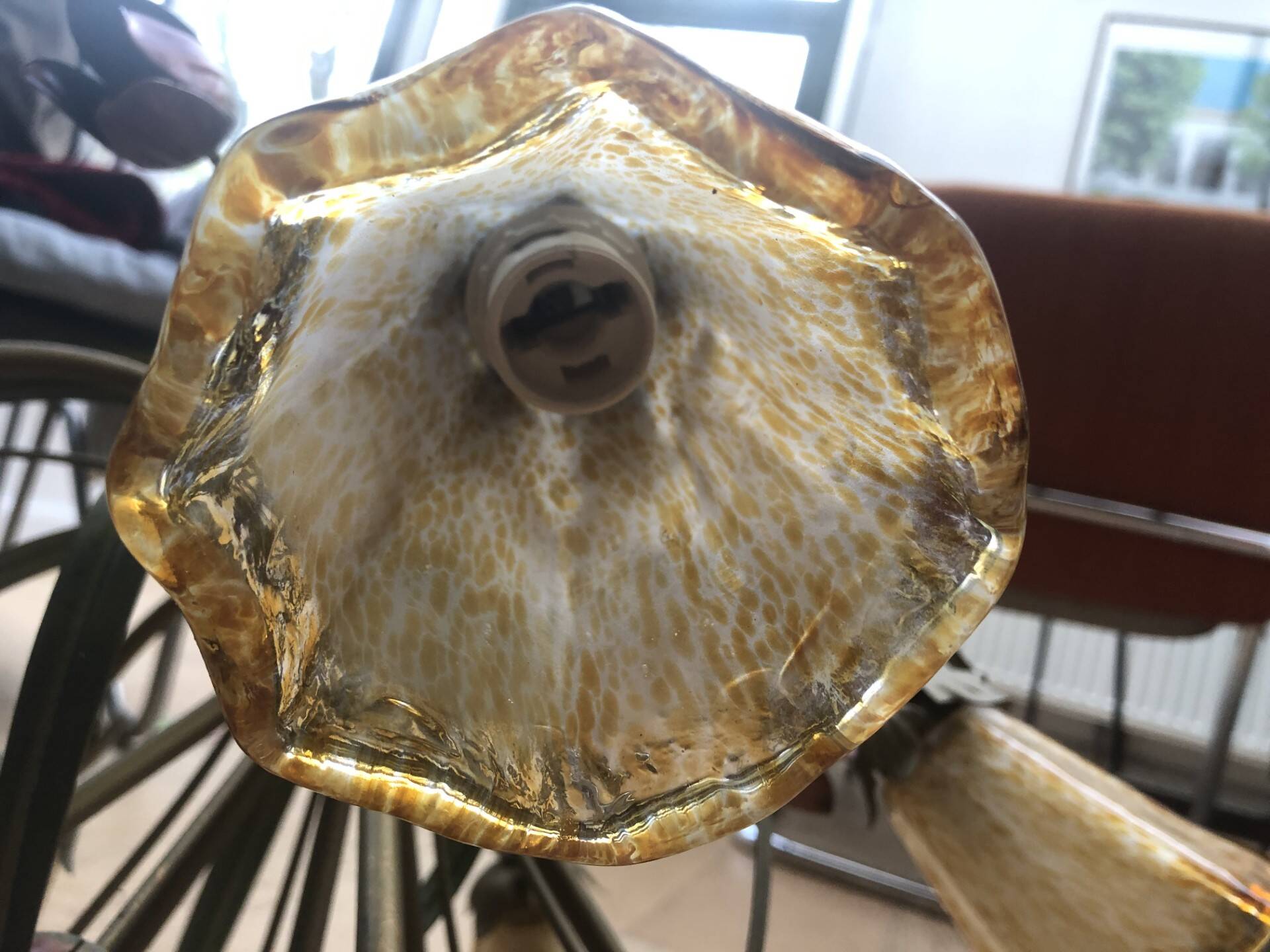 Antique Art Deco metal chandelier with a tinted glass shade.