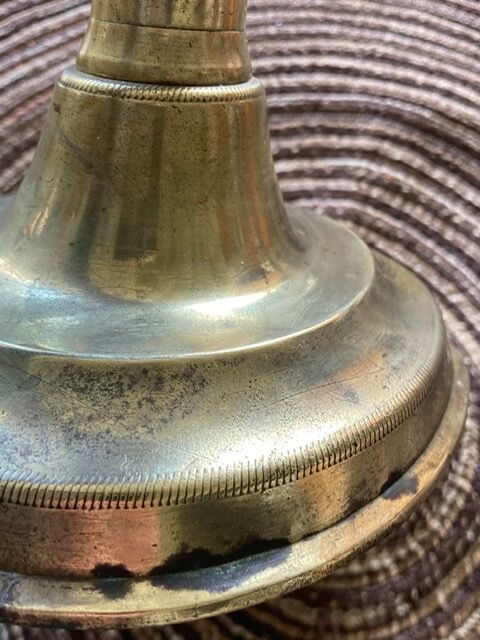 19th century brass candlestick says "to binet"