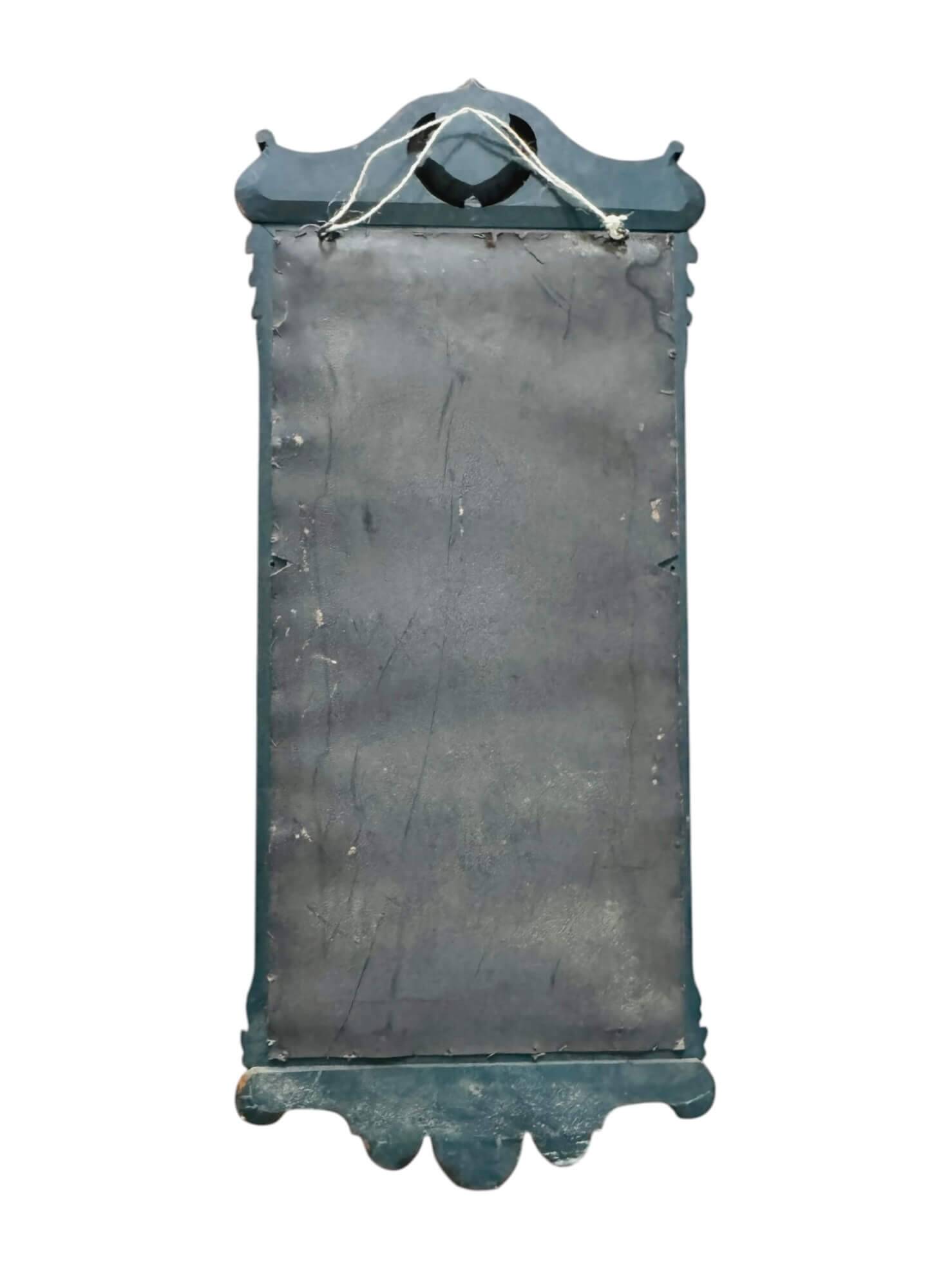 Antique full-length wall mirror in carved wood