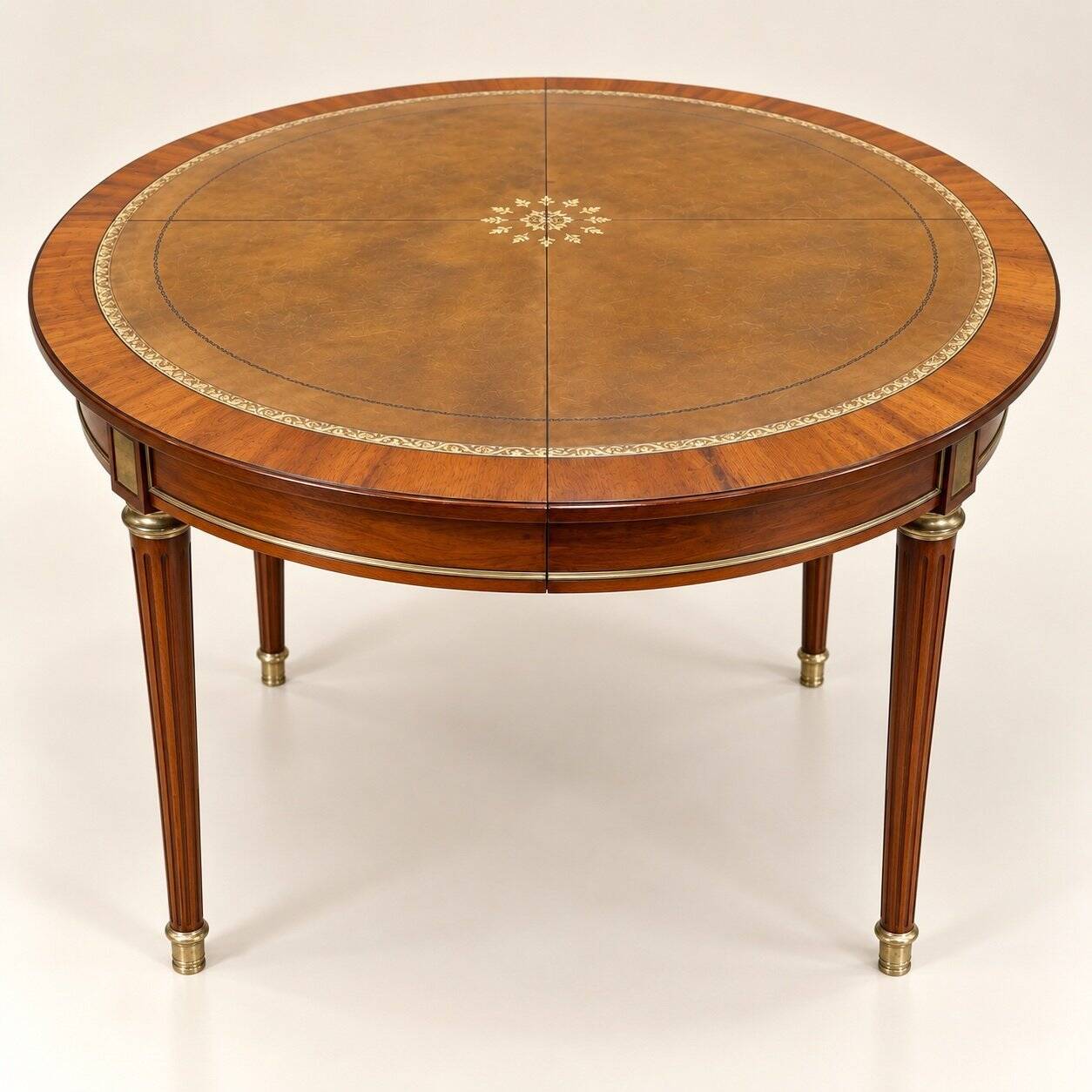 Extendable dining table – Louis XVI style – Mahogany, leather, brass
