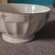 White earthenware bowl with decorative flowers
