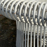 Rattan lounge with two two-seater sofas and a white coffee table.