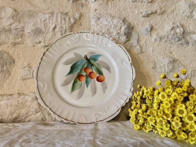 antique earthenware plate with cherries