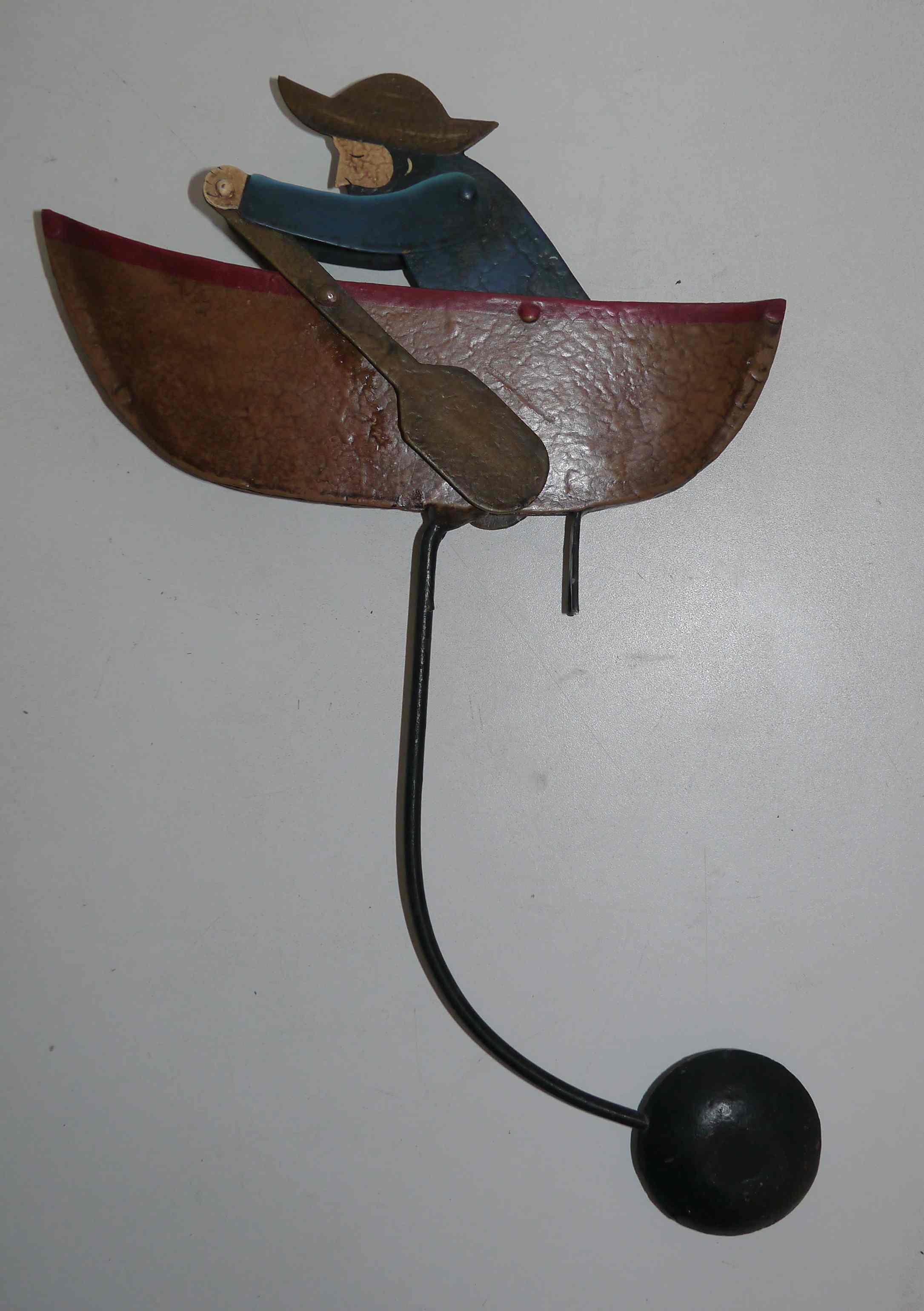 Old fishing counter balance toy in a boat