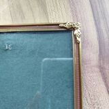 Vintage photo frame in gold and decorated metal