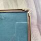 Vintage photo frame in gold and decorated metal