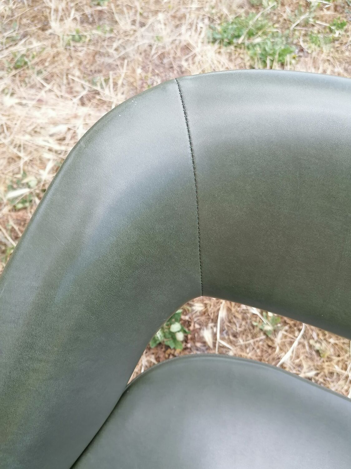 Vintage conference armchair in green skai Roset SNA