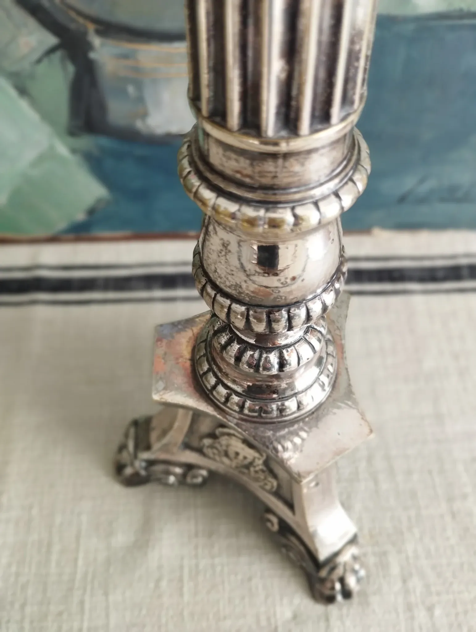Old church candlestick in silver-plated metal