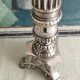 Old church candlestick in silver-plated metal
