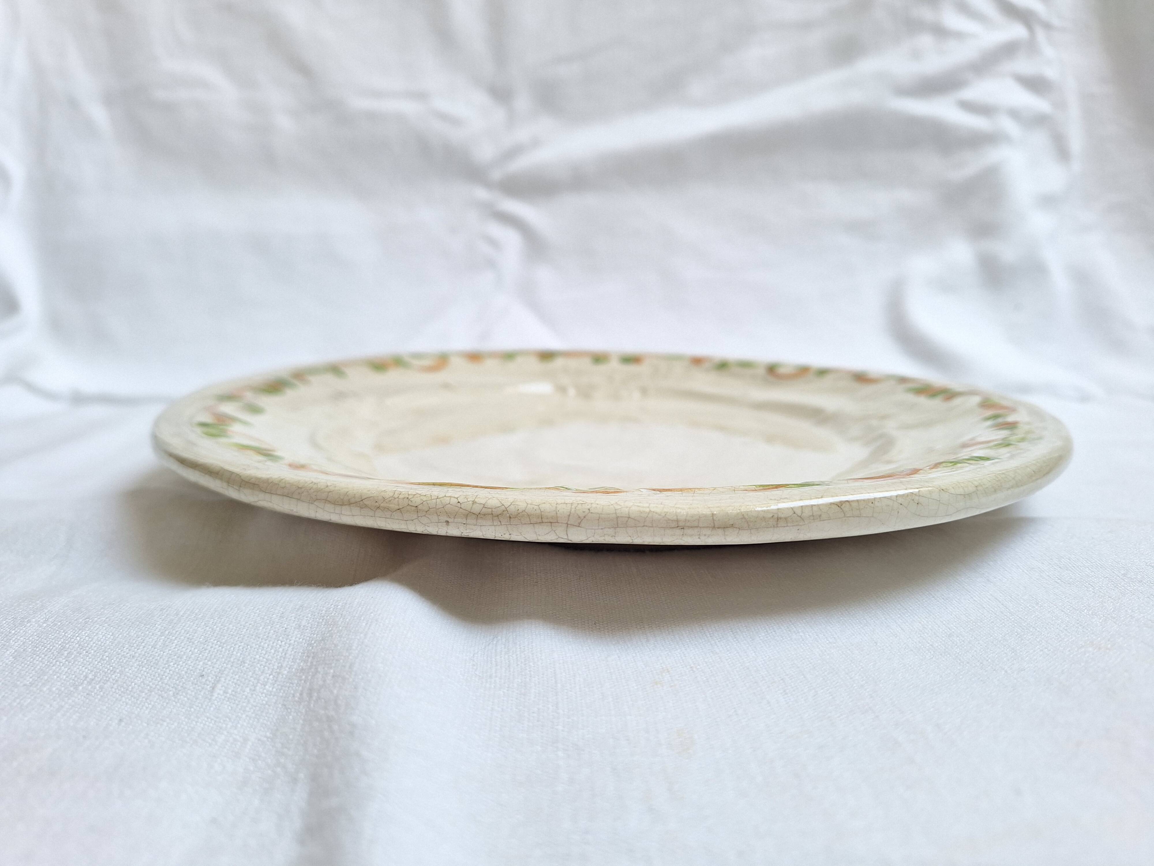 Oval plate, hand-painted meat platter in orange and green.