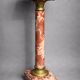 Marble pedestal decorated with gilded brass.