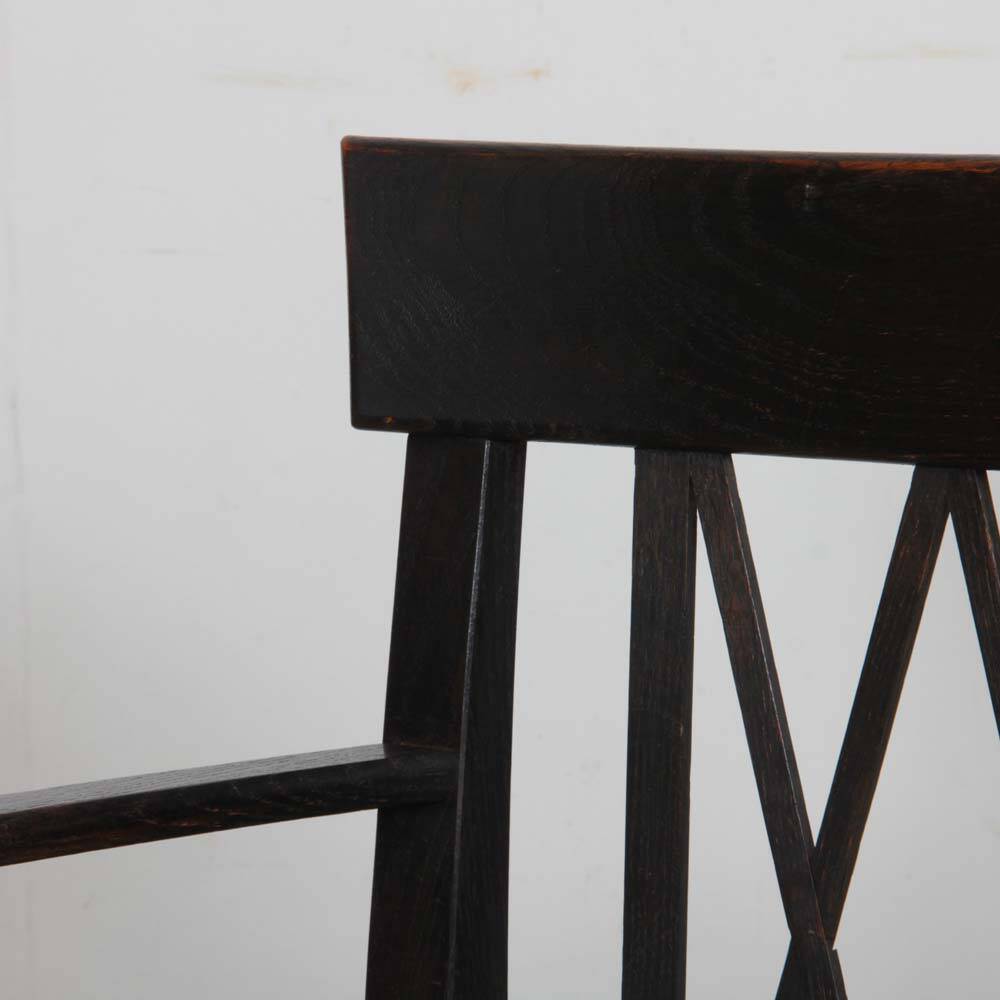 Bridge armchair in wood and leather, work from the early 20th century.