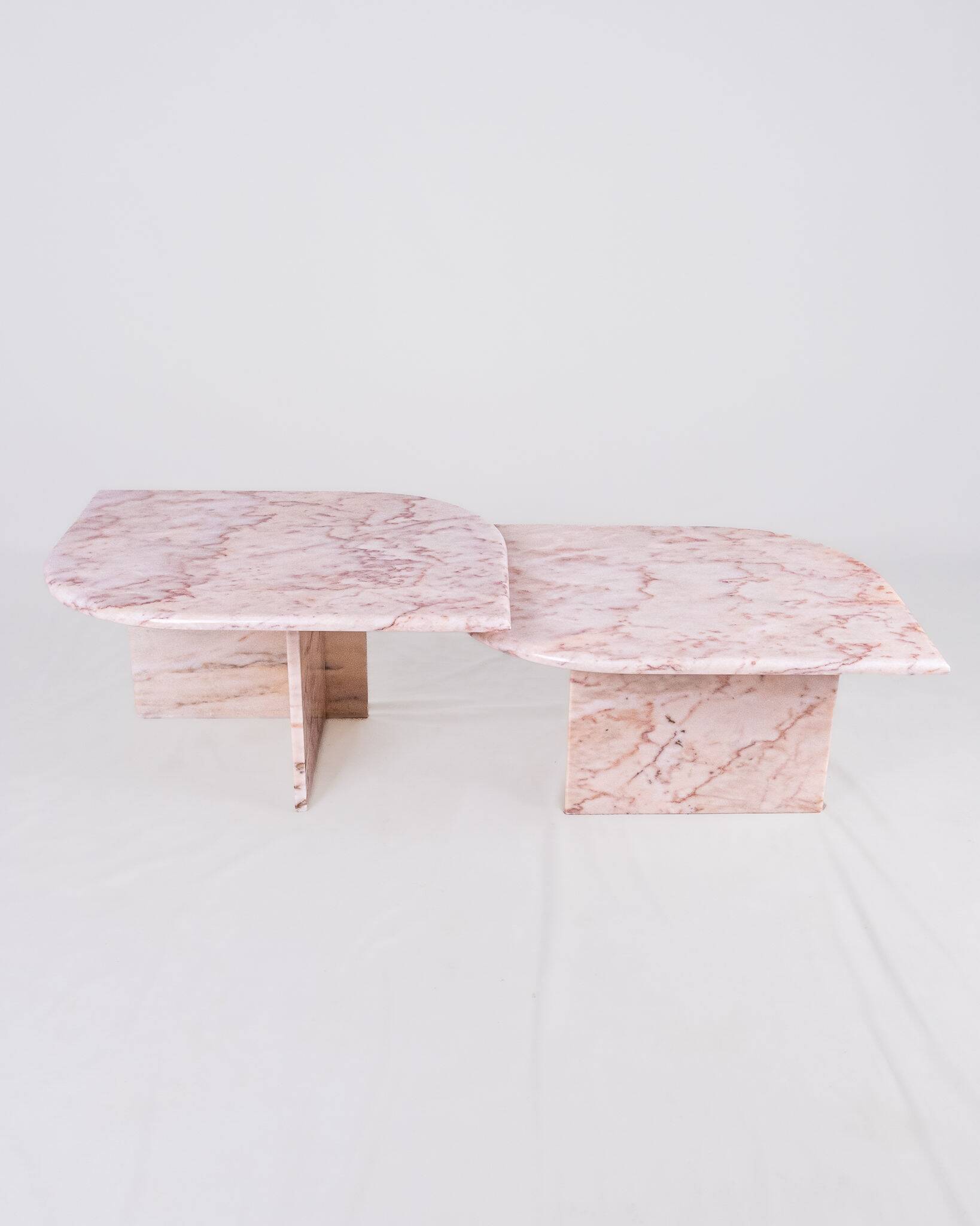 Pair of nesting coffee tables in pink marble, France, 1970s