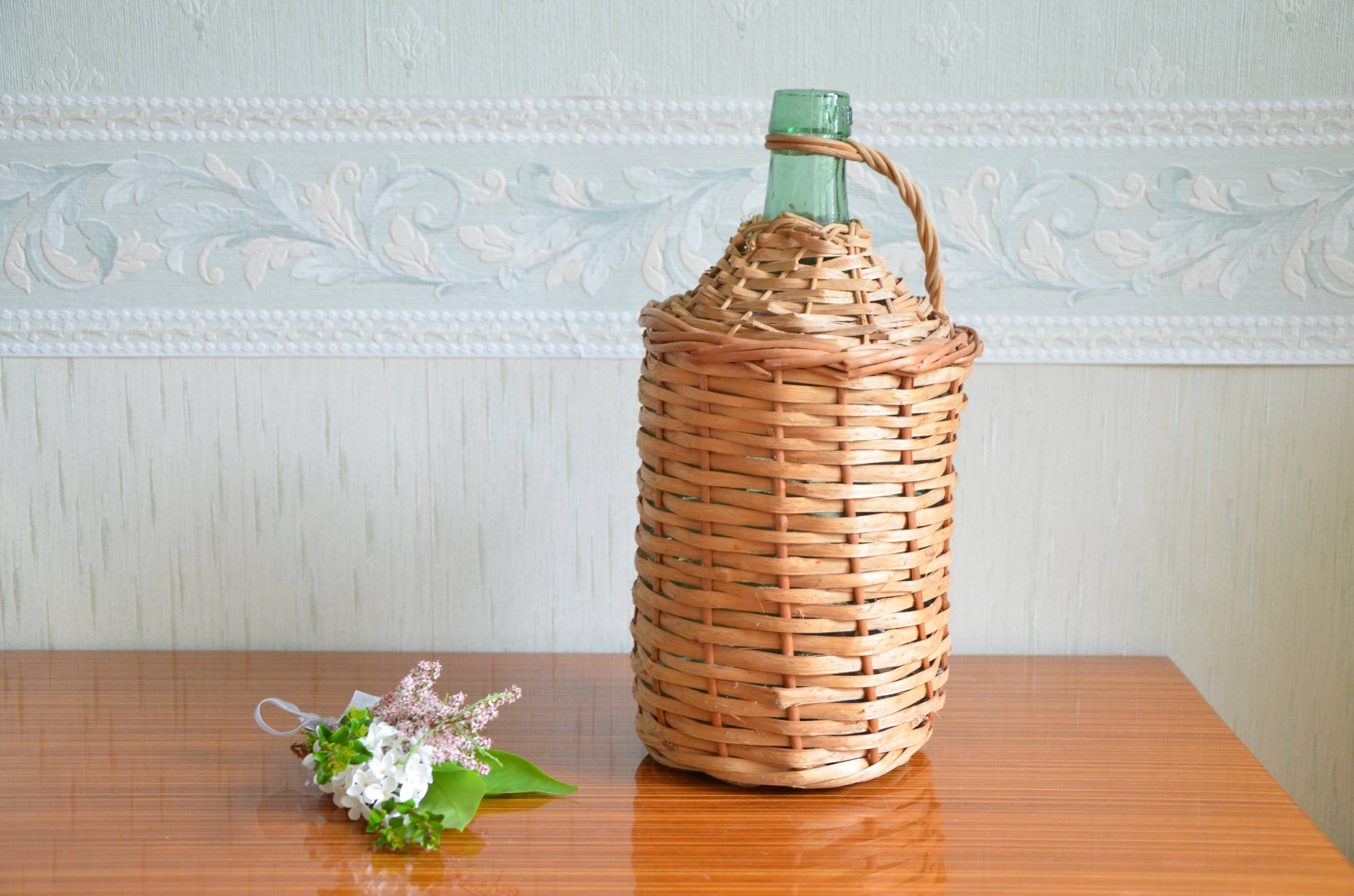 Viresa glass bottle and woven rattan