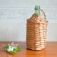 Viresa glass bottle and woven rattan