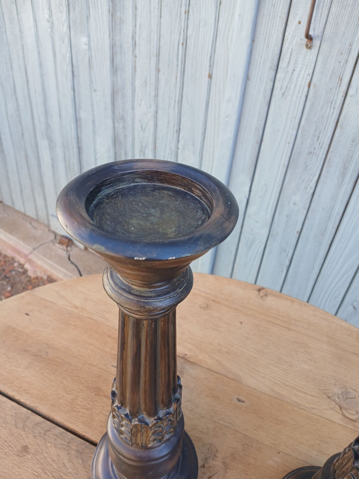 2 carved wooden candlesticks