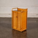 Small storage unit in cane and wood.