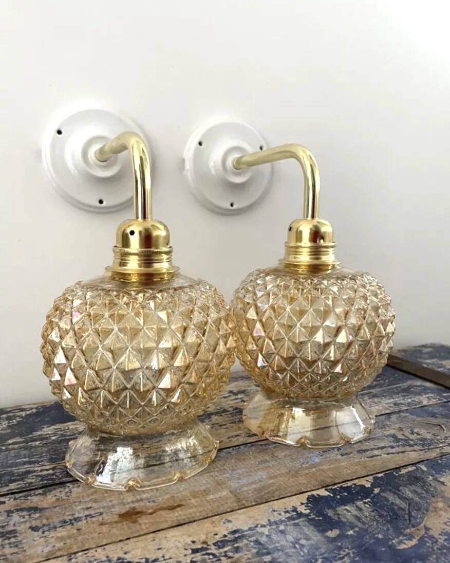 Pair of golden globe wall lights