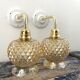 Pair of golden globe wall lights