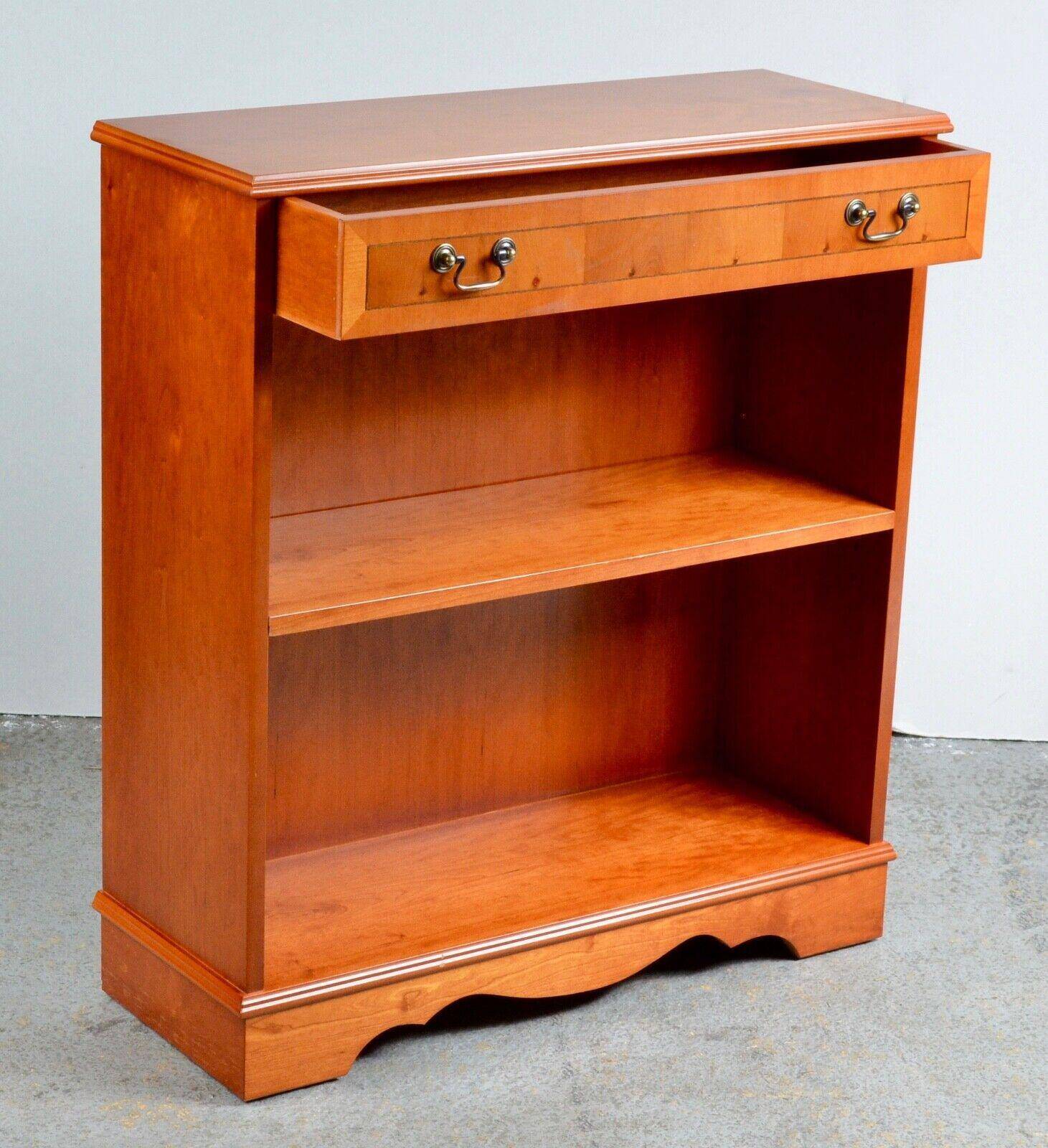 Pair of light walnut bookshelves with inlays and adjustable shelves.