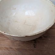 Old opaque porcelain bowl from Gien with a floral decoration.