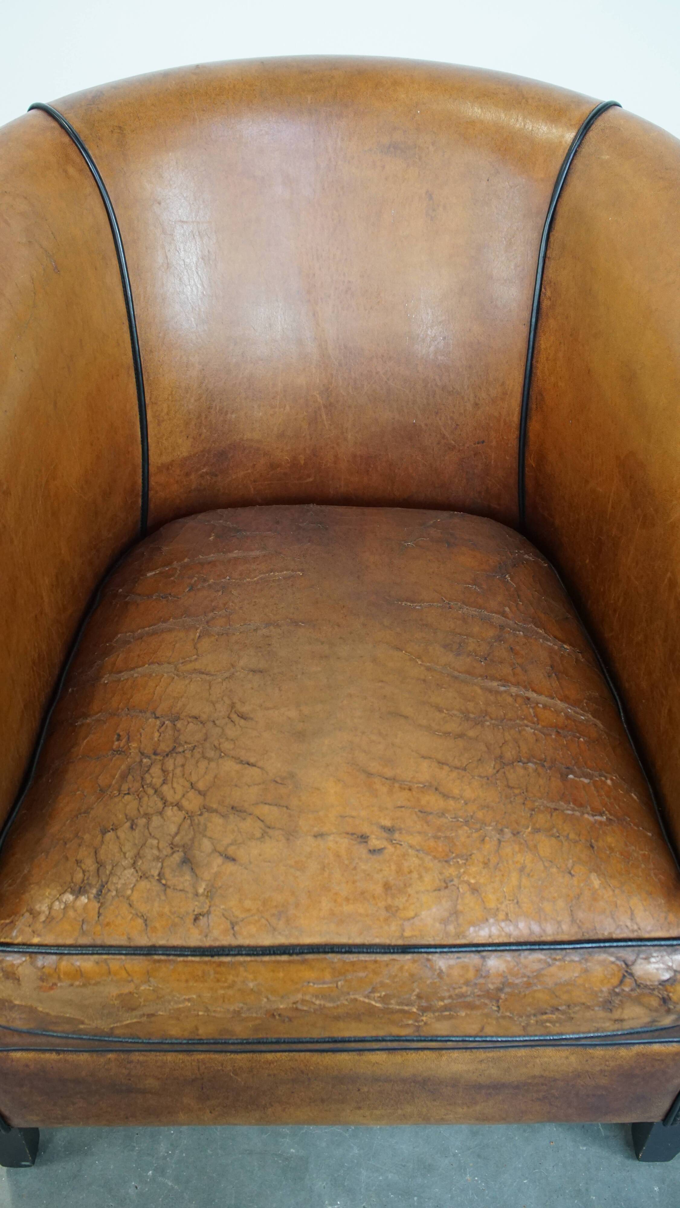 Sheep leather club chair with patina