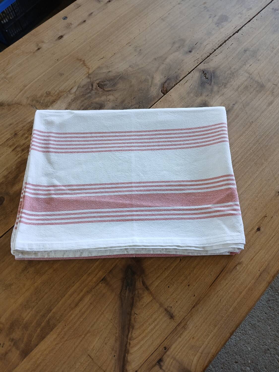 Old pink and white tablecloth