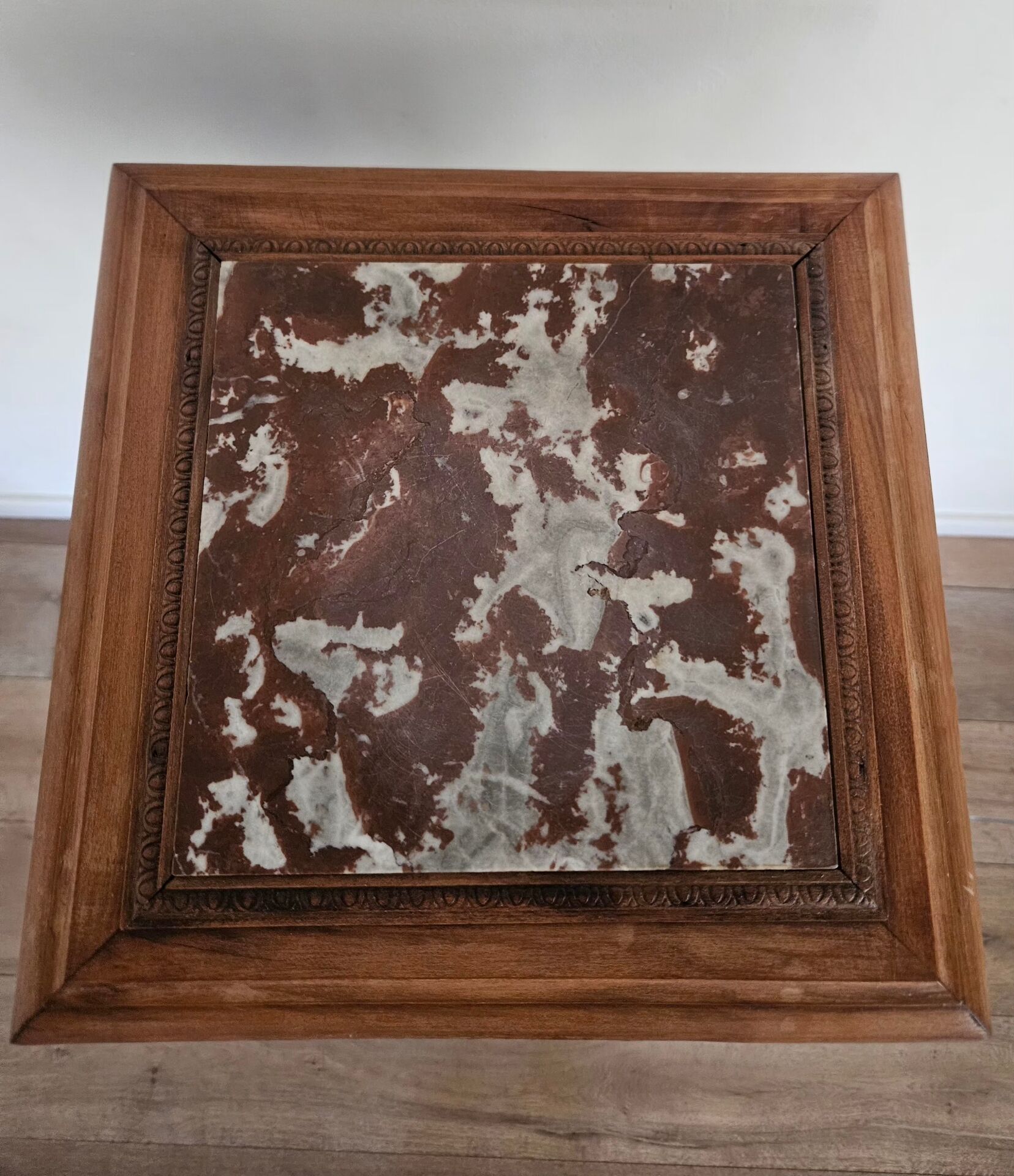 High plant stand in carved wood and Art Nouveau marble.