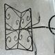 Vintage wrought iron magazine rack